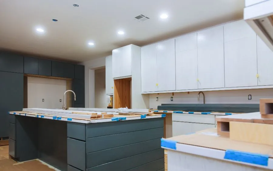 Two-tone kitchen cabinet painting with a dark green island and white upper cabinets, Lake Worth Beach, FL