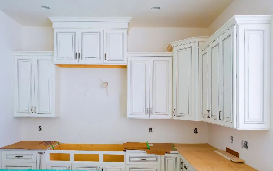 White glazed kitchen cabinets freshly painted before the backsplash goes in, West Palm Beach, FL